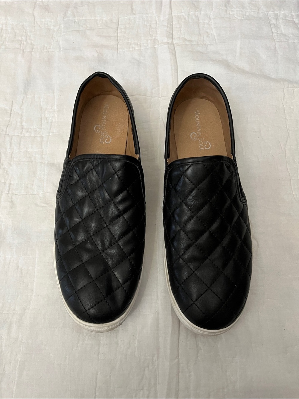 Quilted Slip-On Sneakers in Black -